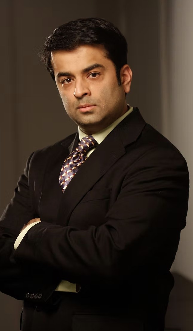 Rajeev Pahuja in a dark suit